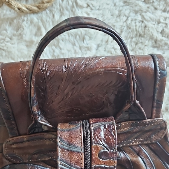 Elegant Brown Leather Backpack with Embossed Design - Picture 9 of 14